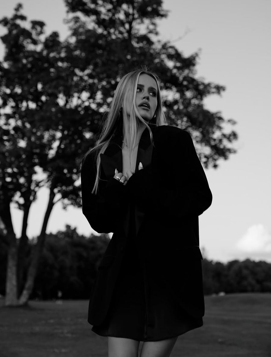 Black and white portrait of Alisa in a blazer at dusk, Kyiv